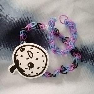 Blue purple and black chocker with a blue and purple bracelet and a strawberry s